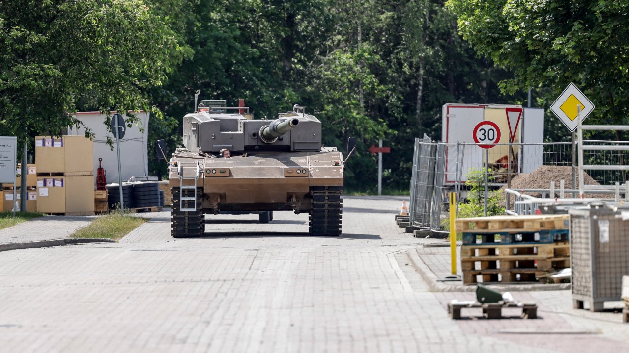 Leopard 2A4 battle tank of German armaments company and automotive supplier Rheinmetall is being tested after getting maintenance at the facility of Rheinmetall in Unterluess, northern Germany, on June 6, 2023. Since Russia invaded Ukraine, Germany has dropped a traditionally pacifist stance and become one of Ukraine's biggest military backers, delivering a wide array of weaponry to Kyiv. Rheinmetall has received a boost from the Ukraine war, posting record results in 2022 and joining Frankfurt's blue-chip DAX index in March 2023. (Photo by Axel Heimken / AFP)