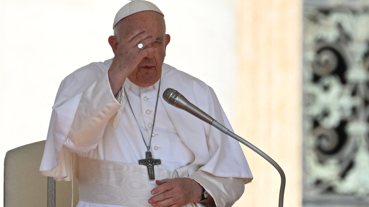 Pope Francis crosses himself during the weekly general audience on June 7, 2023 at St. Peter's square as in The Vatican. (Photo by Andreas SOLARO / AFP)