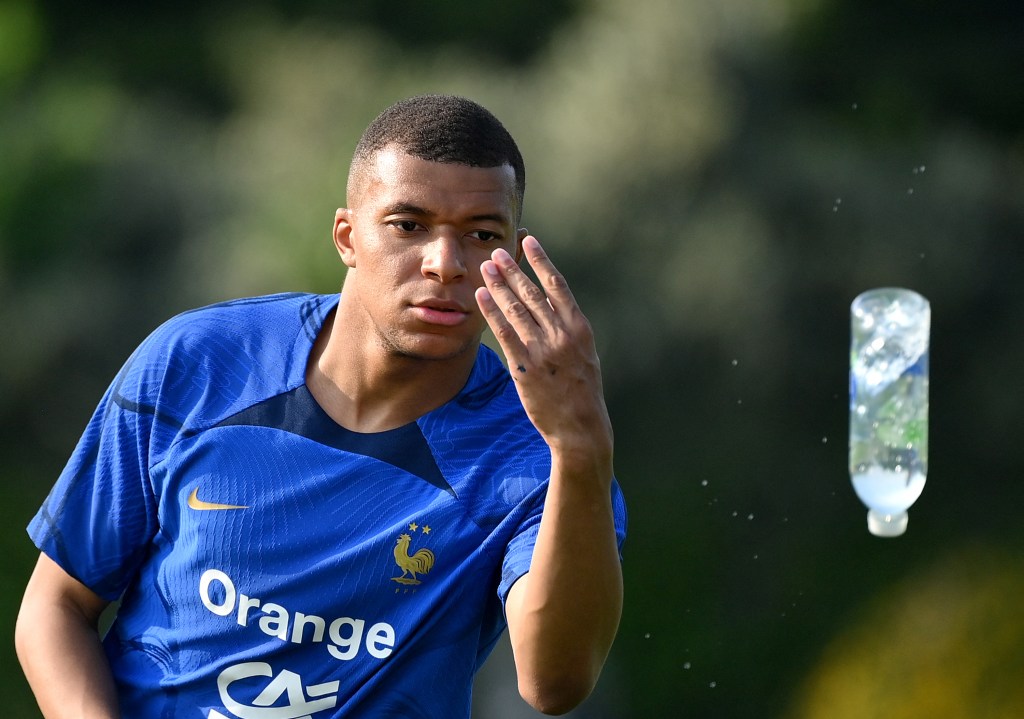 France's forward Kylian Mbappe throws a bottle during a training session ahead of the upcoming UEFA Euro 2024 football tournament qualifying matches in Clairefontaine-en-Yvelines, on June 12, 2023. France will play against Gibraltar on June 16, 2023 and against Greece on June 19, 2023 in their UEFA Euro 2024 Group B Qualification matches. (Photo by FRANCK FIFE / AFP)