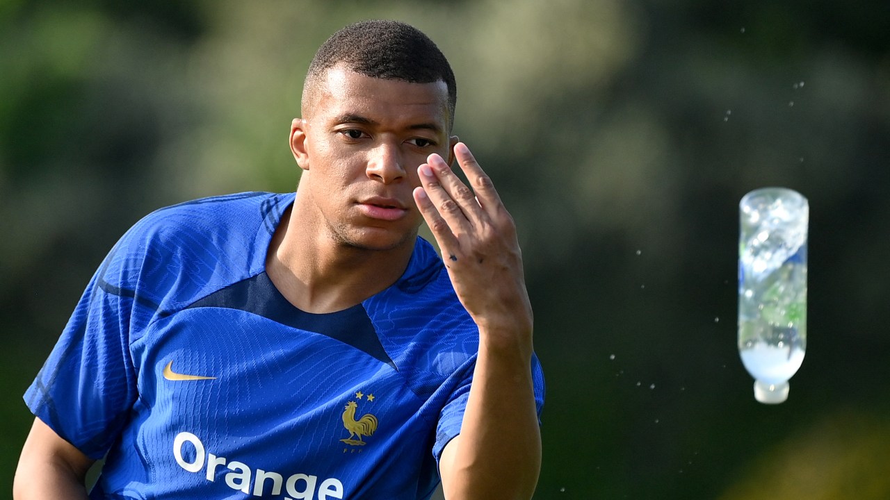 France's forward Kylian Mbappe throws a bottle during a training session ahead of the upcoming UEFA Euro 2024 football tournament qualifying matches in Clairefontaine-en-Yvelines, on June 12, 2023. France will play against Gibraltar on June 16, 2023 and against Greece on June 19, 2023 in their UEFA Euro 2024 Group B Qualification matches. (Photo by FRANCK FIFE / AFP)
