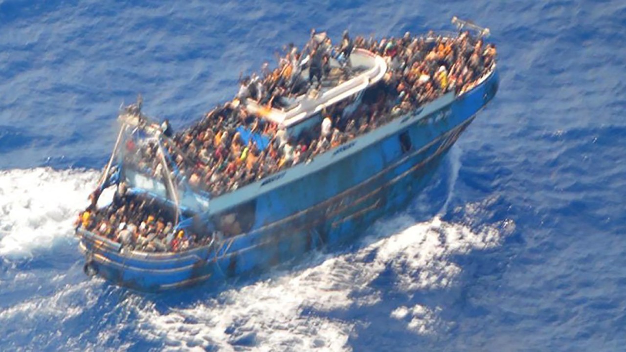 This image released by The Hellenic Coastguard on June 14, 2023, shows an aerial view taken from a rescue helicopter, of migrants onboard a fishing vessel in the waters off the Peloponnese coast of Greece on June 13, 2023. At least 79 migrants died after their fishing boat sank off the Peloponnese, Greece's coastguard said, as fears mounted that the death toll could rise much higher. (Photo by HELLENIC COASTGUARD / AFP) / RESTRICTED TO EDITORIAL USE - MANDATORY CREDIT "AFP PHOTO/HELLENIC COASTGUARD " - NO MARKETING - NO ADVERTISING CAMPAIGNS - DISTRIBUTED AS A SERVICE TO CLIENTS