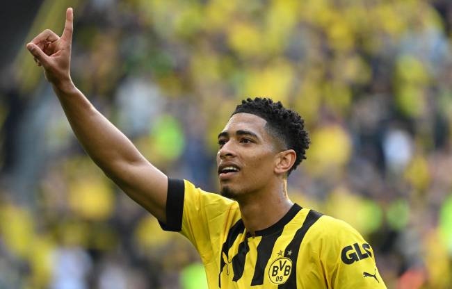 FILES-FBL-GER-ESP-ENS-BELLINGHAM (FILES) Dortmund's English midfielder Jude Bellingham celebrates after scoring the 2-0 goal during the German first division Bundesliga football match between BVB Borussia Dortmund and Borussia Moenchengladbach in Dortmund, western Germany on May 13, 2023. English teenager Jude Bellingham will move from Borussia Dortmund to Real Madrid for a fee in excess of 100 million euros (7 million), the German side announced on June 14, 2023. Dortmund confirmed the two teams had reached a