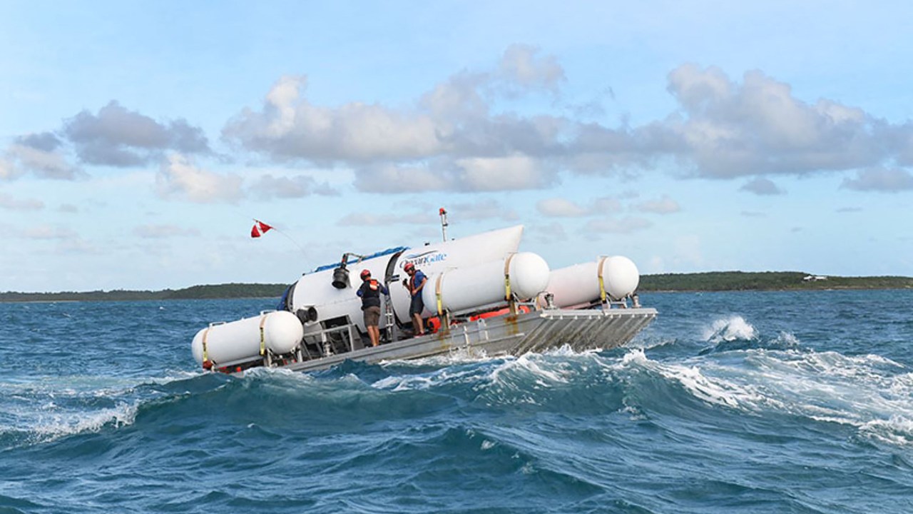 This undated image courtesy of OceanGate Expeditions, shows their Titan submersible being towed to a dive location. Rescue teams expanded their search underwater on June 20, 2023, as they raced against time to find a Titan deep-diving tourist submersible that went missing near the wreck of the Titanic with five people on board and limited oxygen. All communication was lost with the 21-foot (6.5-meter) Titan craft during a descent June 18 to the Titanic, which sits at a depth of crushing pressure more than two miles (nearly four kilometers) below the surface of the North Atlantic. (Photo by Handout / OceanGate Expeditions / AFP) / RESTRICTED TO EDITORIAL USE - MANDATORY CREDIT "AFP PHOTO / OceanGate Expeditions" - NO MARKETING NO ADVERTISING CAMPAIGNS - DISTRIBUTED AS A SERVICE TO CLIENTS