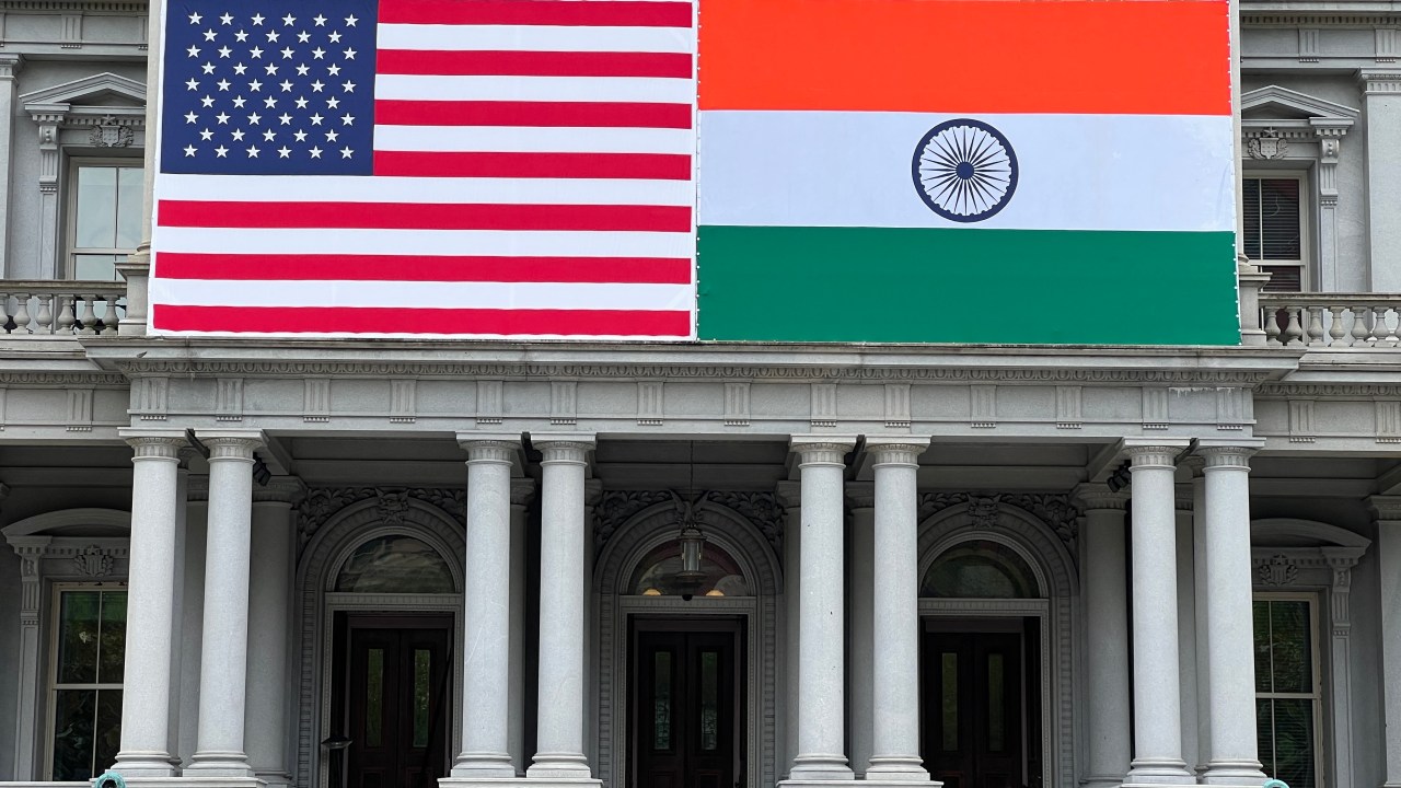 Flags of India and US adorn the Eisenhower Executive Office Building of the White House in Washington, DC on June 20, 2023. US President Joe Biden will be hosting India's Prime Minister Narendra Modi for a State visit on June 22, 2023. (Photo by Daniel SLIM / AFP)