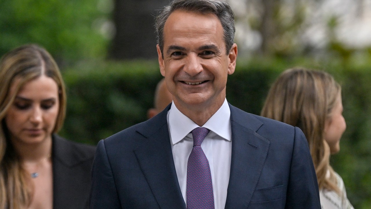 Greece's newly re-elected Prime Minister Kyriakos Mitsotakis leaves the Presidental Palace in Athens after his swearing in ceremony on June 26, 2023, following the general elections. Mitsotakis embarked on June 26, 2023 on his second term as Greece's prime minister with a vow to accelerate institutional and economic reforms, after voters handed him a huge election victory for the second time in five weeks. (Photo by Louisa GOULIAMAKI / AFP)