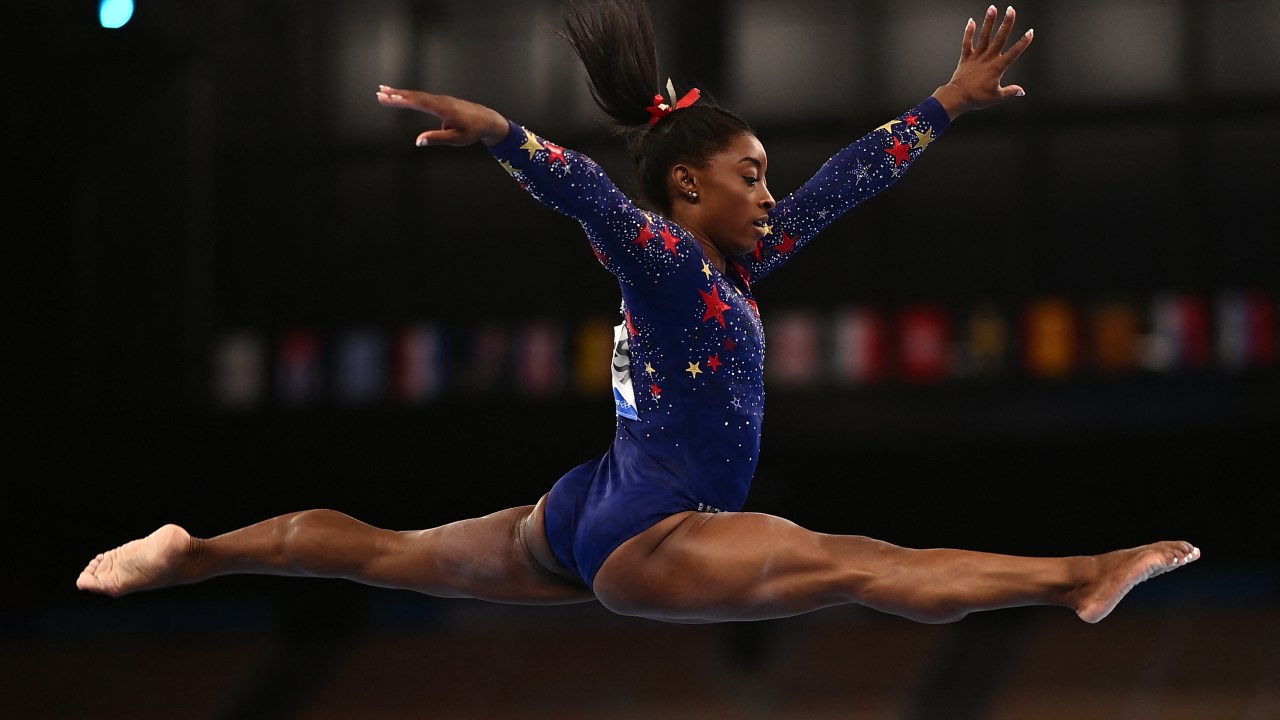 (FILES) US' Simone Biles competes in the artistic gymnastics balance beam event of the women's qualification during the Tokyo 2020 Olympic Games at the Ariake Gymnastics Centre in Tokyo on July 25, 2021. US gymnastics star Simone Biles is set to make her first competitive appearance since the Tokyo Olympics after entering the US Classic, USA Gymnastics announced on June 28, 2023. (Photo by Loic VENANCE / AFP)