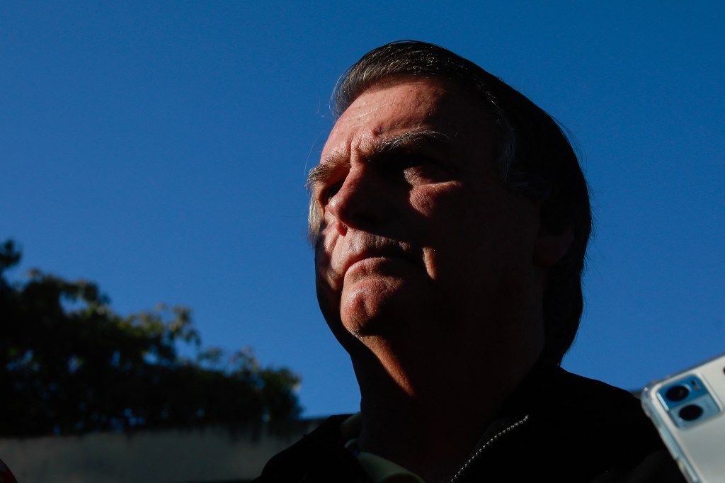 Former Brazilian President Jair Bolsonaro delivers a press conference at the Juscelino Kubitschek airport in Brasilia on June 29, 2023. Judges will continue delivering verdicts Thursday on charges that far-right ex-president Jair Bolsonaro broke the law with his unproven allegations against Brazil's election system, which could see him banned from holding office for eight years. (Photo by Sergio Lima / AFP)