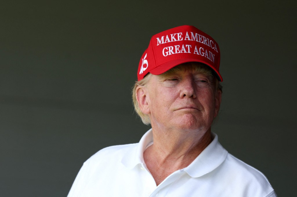 STERLING, VIRGINIA - MAY 26: Former US President Donald Trump watches from a box on the 18th green during day one of the LIV Golf Invitational - DC at Trump National Golf Club on May 26, 2023 in Sterling, Virginia. Rob Carr/Getty Images/AFP (Photo by Rob Carr / GETTY IMAGES NORTH AMERICA / Getty Images via AFP)