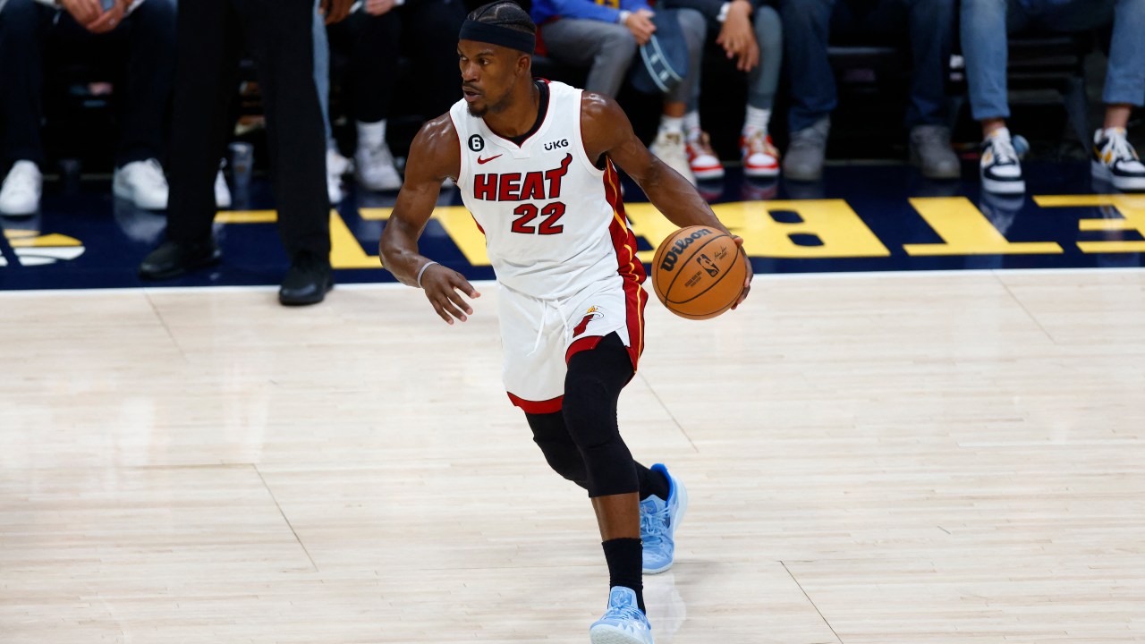 DENVER, COLORADO - JUNE 04: Jimmy Butler #22 of the Miami Heat dribbles the ball during the first quarter against the Denver Nuggets in Game Two of the 2023 NBA Finals at Ball Arena on June 04, 2023 in Denver, Colorado. NOTE TO USER: User expressly acknowledges and agrees that, by downloading and or using this photograph, User is consenting to the terms and conditions of the Getty Images License Agreement. Justin Edmonds/Getty Images/AFP (Photo by Justin Edmonds / GETTY IMAGES NORTH AMERICA / Getty Images via AFP)