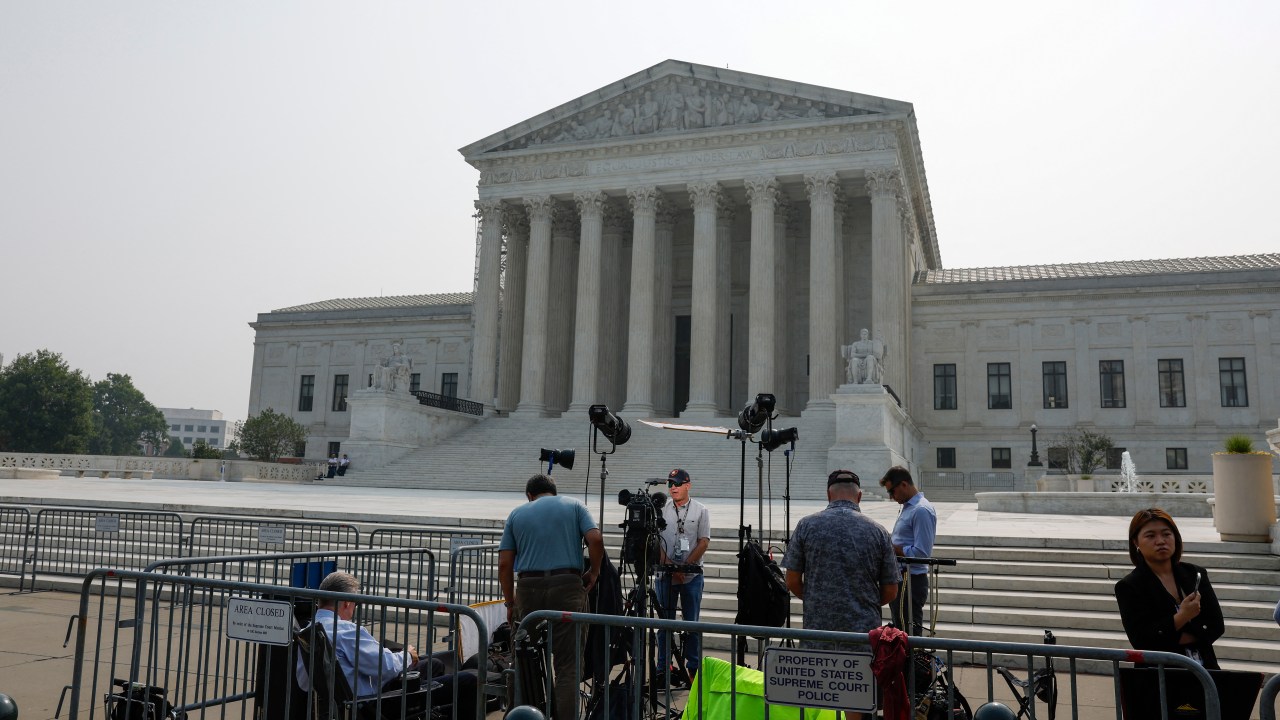 WASHINGTON, DC - JUNE 29: Members of the media stand outside the U.S. Supreme Court Building on June 29, 2023 in Washington, DC. In a 6-3 vote, Supreme Court Justices ruled that race-conscious admissions programs at Harvard and the University of North Carolina are unconstitutional, setting precedent for affirmative action in other universities and colleges. Anna Moneymaker/Getty Images/AFP (Photo by Anna Moneymaker / GETTY IMAGES NORTH AMERICA / Getty Images via AFP)