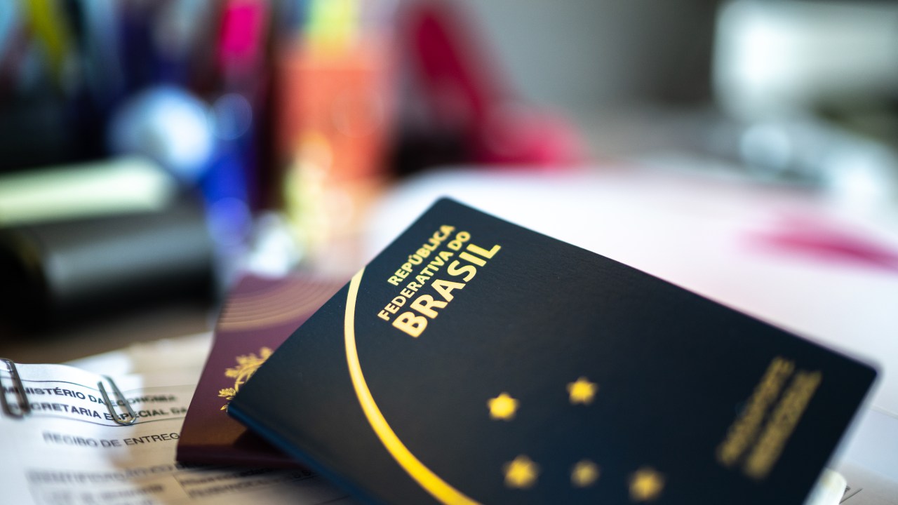 Brazilian and portuguese passport at desk
