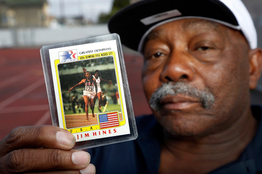 OAKLAND, CALIFORNIA - AUG 18: Jim Hines, known as the fastest man alive in the1968 Olympics after being the first to break the ten second barrier in the 100 meter race, holds up an Olympic trading card of his winning race for a portrait at McClymonds High School in Oakland, Calif., on Thursday, Aug. 18, 2016 where he graduated in 1964. Hines won two gold medals in 1968, one for the 100 meter race for his time of 9.95 and one with his team in the 4X100 meter relay. (Photo by Laura A. Oda/MediaNews Group/East Bay Times via Getty ImagesGroup)