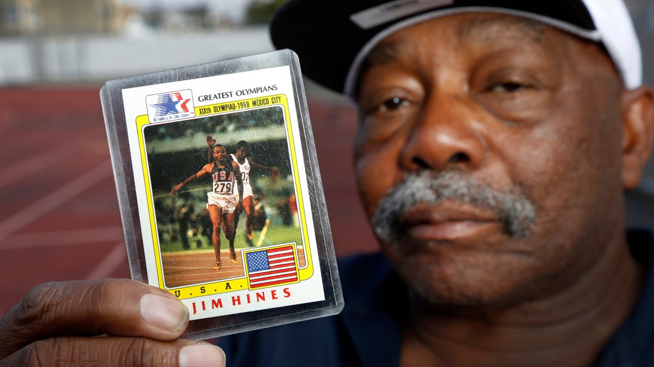 OAKLAND, CALIFORNIA - AUG 18: Jim Hines, known as the fastest man alive in the1968 Olympics after being the first to break the ten second barrier in the 100 meter race, holds up an Olympic trading card of his winning race for a portrait at McClymonds High School in Oakland, Calif., on Thursday, Aug. 18, 2016 where he graduated in 1964. Hines won two gold medals in 1968, one for the 100 meter race for his time of 9.95 and one with his team in the 4X100 meter relay. (Photo by Laura A. Oda/MediaNews Group/East Bay Times via Getty ImagesGroup)