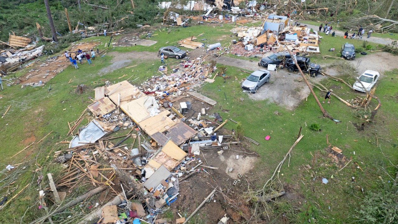 LOUIN, MISSISSIPPI - JUNE 19: In this aerial view, residents attempt to salvage what they can from a destroyed dwelling after a tornado struck off Country Road 16, on June 19, 2023 in Louin, Mississippi. Multiple confirmed tornadoes in Mississippi overnight left at least one person killed and 25 injured during the storms. (Photo by Michael DeMocker/Getty Images)