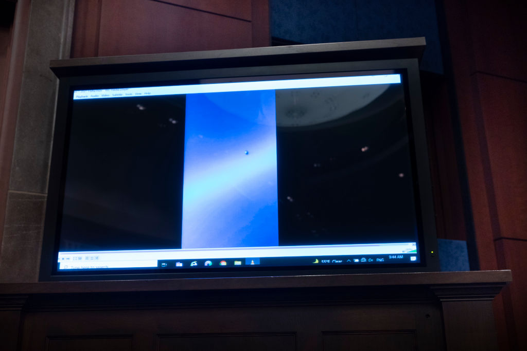 WASHINGTON, DC - MAY 17: A video of unidentified aerial phenomena is played as U.S. Deputy Director of Naval Intelligence Scott Bray testifies before a House Intelligence Committee subcommittee hearing at the U.S. Capitol on May 17, 2022 in Washington, DC. The committee met to investigate Unidentified Aerial Phenomena, commonly referred to as Unidentified Flying Objects (UFOs). (Photo by Kevin Dietsch/Getty Images)
