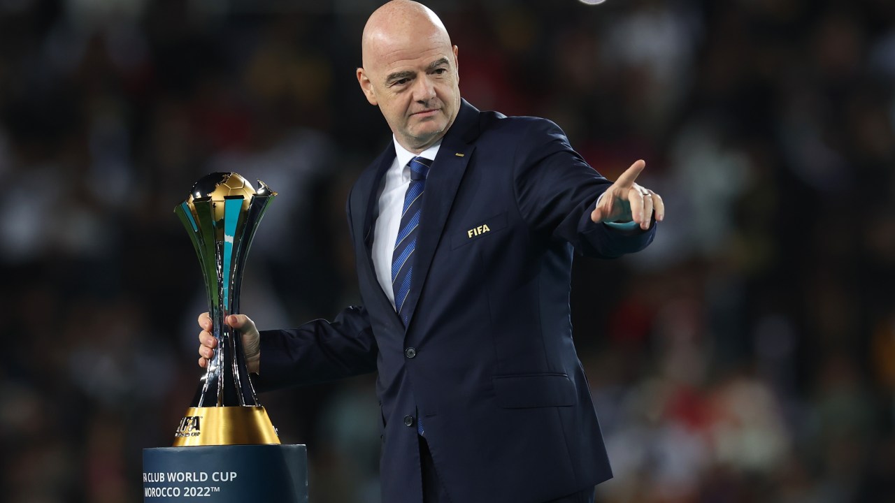 RABAT, MOROCCO - FEBRUARY 11: Gianni Infantino, President of FIFA hands over the trophy after the FIFA Club World Cup Morocco 2022 Final match between Real Madrid and Al Hilal at Prince Moulay Abdellah on February 11, 2023 in Rabat, Morocco. (Photo by Alex Grimm - FIFA/FIFA via Getty Images)