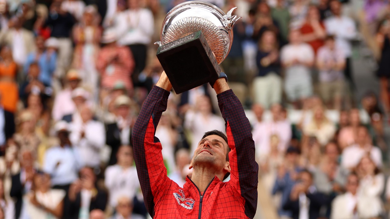 PARIS, FRANCE - JUNE 11: Novak Djokovic of Serbia lifts the winners trophy after victory against Casper Ruud of Norway in the Men's Singles Final match on Day Fifteen of the 2023 French Open at Roland Garros on June 11, 2023 in Paris, France. (Photo by Clive Brunskill/Getty Images)