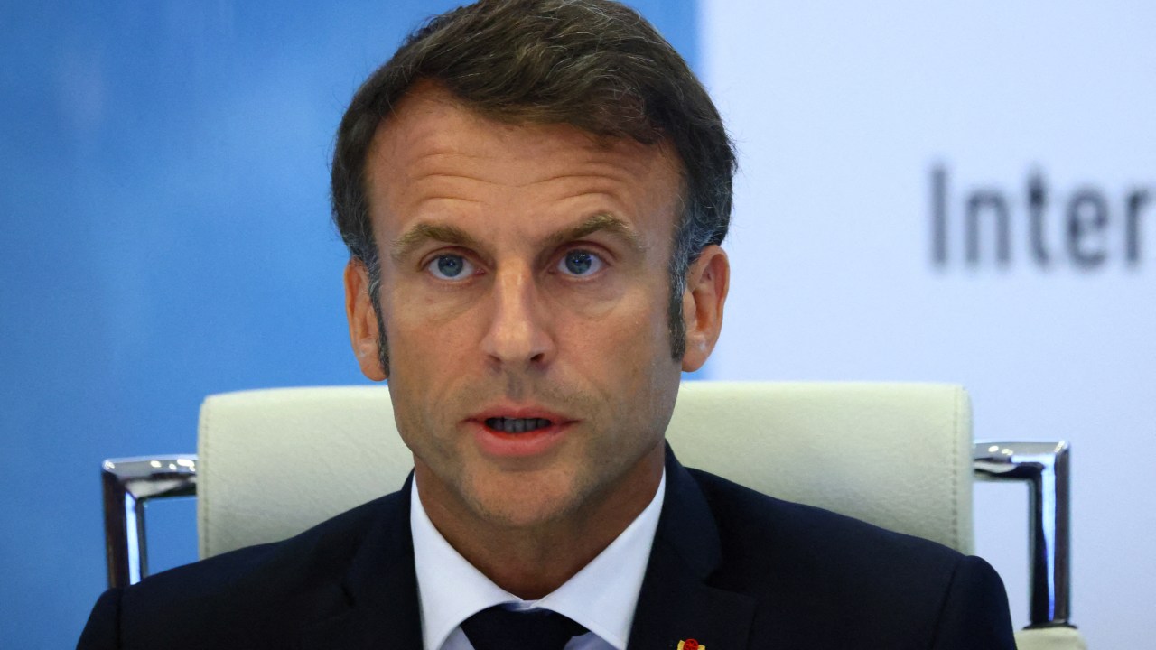 French President Emmanuel Macron addresses a intermninisterial crisis unit (Cellule interministerielle de crise - CIC) meeting after riots erupted for the third night in a row across the country following the death of Nahel, a 17-year-old teenager killed during a traffic stop in Nanterre by a French police officer, at the emergency crisis center of the Interior Ministry in Paris, France, June 30, 2023. (Photo by YVES HERMAN / POOL / AFP)