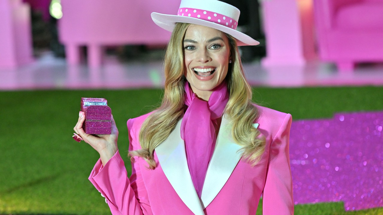 (FILES) Australian actress Margot Robbie poses for a photo during a pink carpet event to promote her new film "Barbie" in Seoul on July 2, 2023. Vietnam has banned the upcoming "Barbie" movie from cinemas over scenes featuring a map of the South China Sea showing Beijing's claims in the flashpoint waters, state media reported July 3. (Photo by Jung Yeon-je / AFP)