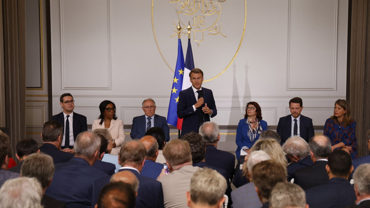 France's President Emmanuel Macron addresses mayors of cities affected by the violent clashes that erupted after a teen was shot dead by police last week during a meeting at the presidential Elysee Palace in Paris on July 4, 2023. (Photo by Ludovic MARIN / POOL / AFP)