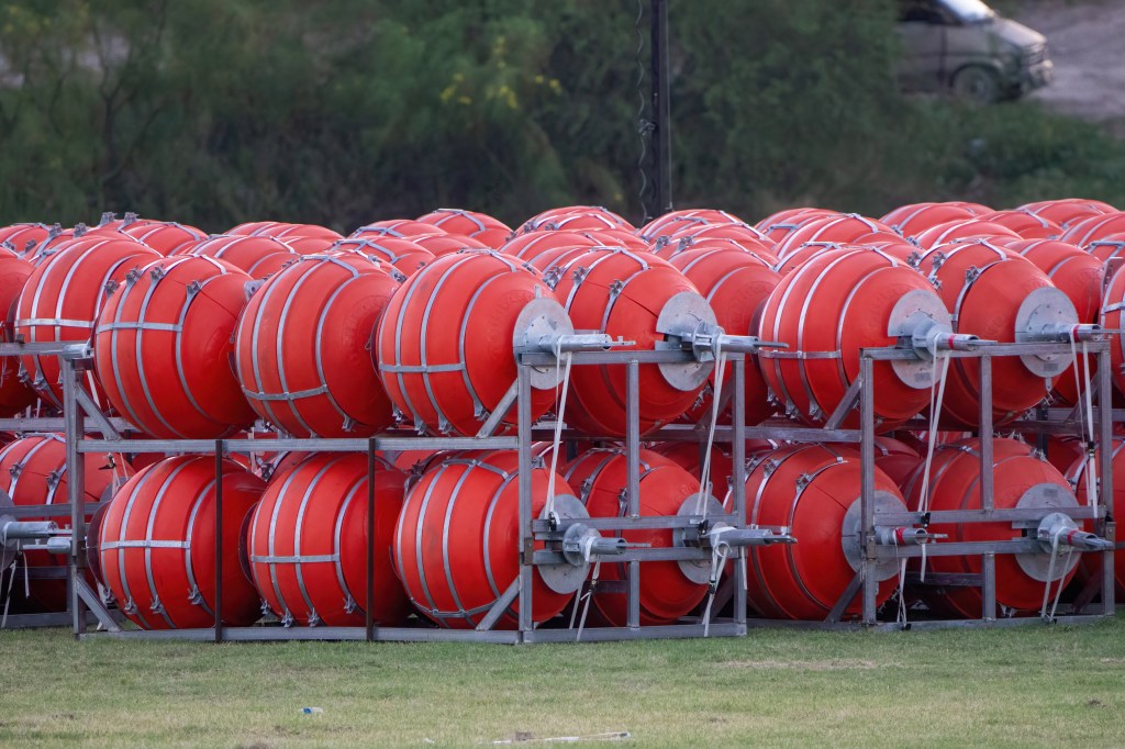 Buoy barriers prepared for installation during a water-based border operation on July 8, 2023 in Eagle Pass, Texas. A Texas businessman has filed a lawsuit in a bid to stop the state's governor from placing huge buoys in the Rio Grande to block migrants trying to cross the river, the man's lawyer said July 8."New marine barrier installation on the Rio Grande begins today," Governor Greg Abbott, a Republican, said July 7 on Twitter, in a post that included video of workers unloading huge orange buoys from flat-bed trucks. (Photo by SUZANNE CORDEIRO / AFP)
