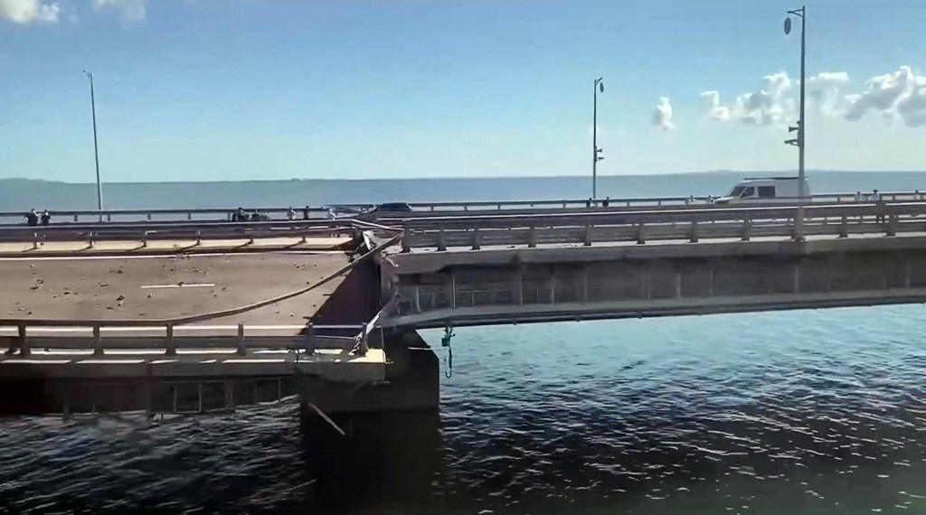 This video grab taken from a ?rimea24TV footage on July 17, 2023 shows the damaged Kerch bridge -- linking Crimea to Russia -- which was heavily damaged following an attack. Russia on July 17, 2023, said a Ukrainian attack on the bridge linking Moscow-annexed Crimea to the Russian mainland killed a civilian couple and wounded their child. Moscow said two drones had hit the bridge in the early hours and blamed "the Kyiv regime." (Photo by Crimea24TV / AFP)