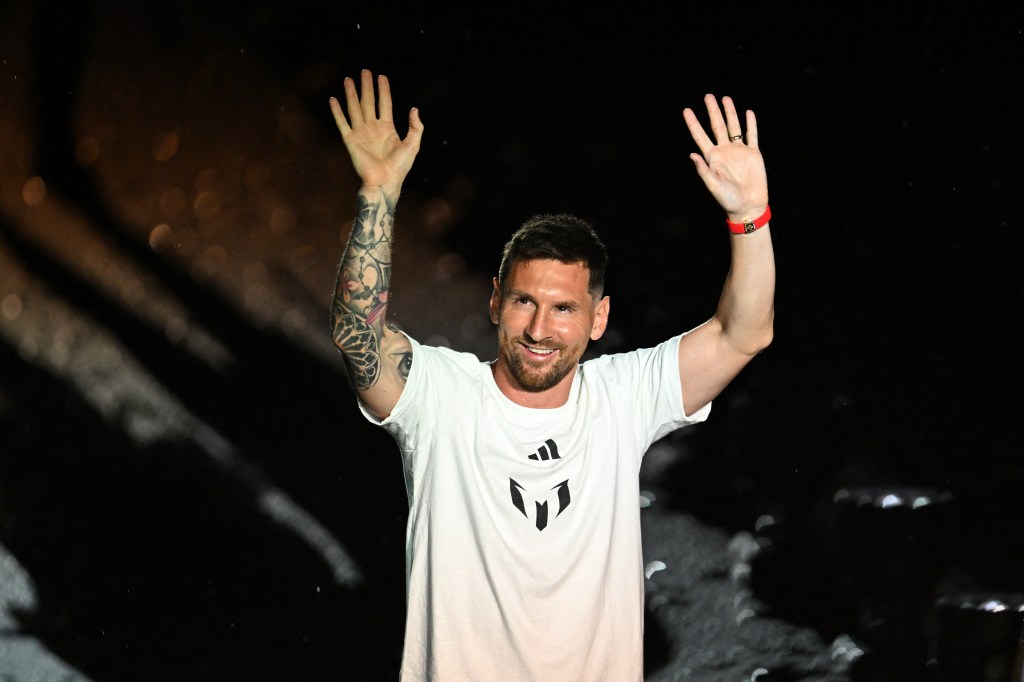 Argentine soccer star Lionel Messi waves as he is presented as the newest player for Major League Soccer's Inter Miami CF, at DRV PNK Stadium in Fort Lauderdale, Florida, on July 16, 2023. (Photo by CHANDAN KHANNA / AFP)
