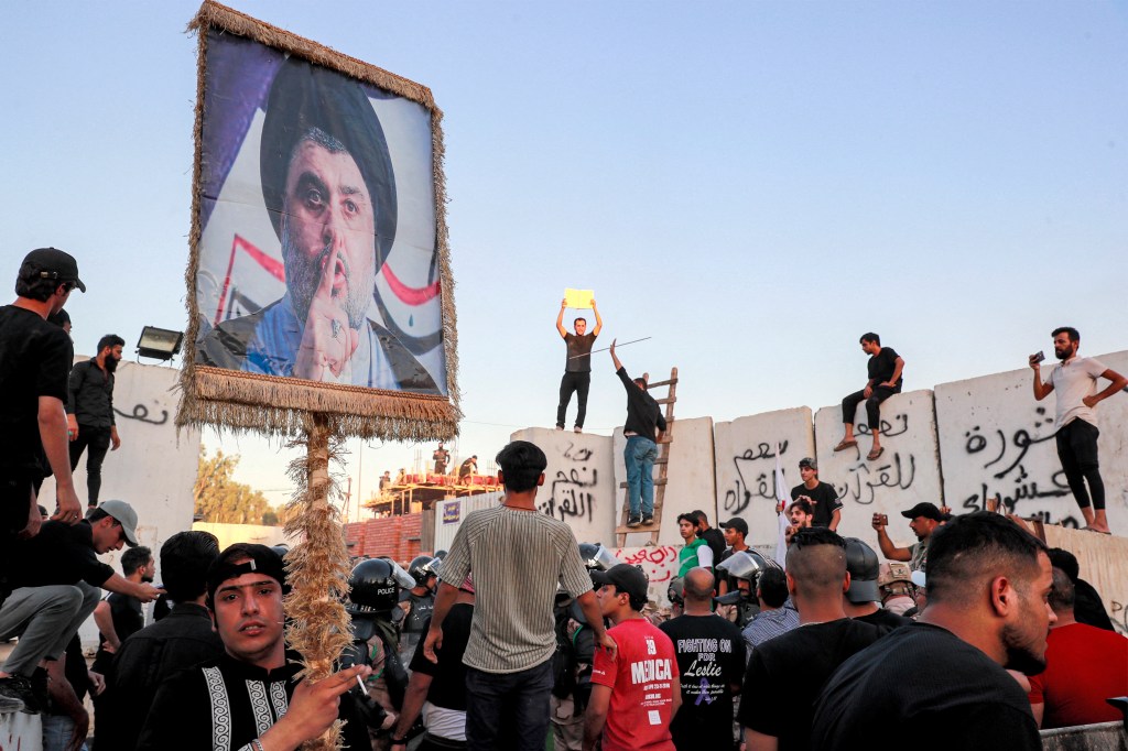 Supporters of Iraqi Shiite cleric Moqtada al-Sadr gather for a protest outside the Swedish embassy in Baghdad on July 20, 2023. Protesters set fire to Sweden's embassy in the Iraqi capital early on July 20 ahead of a planned burning of a Koran in Sweden. Swedish authorities approved an assembly to be held later on July 20 outside the Iraqi embassy in Stockholm, where organisers plan to burn a copy of the Koran as well as an Iraqi flag. (Photo by Ahmad AL-RUBAYE / AFP)