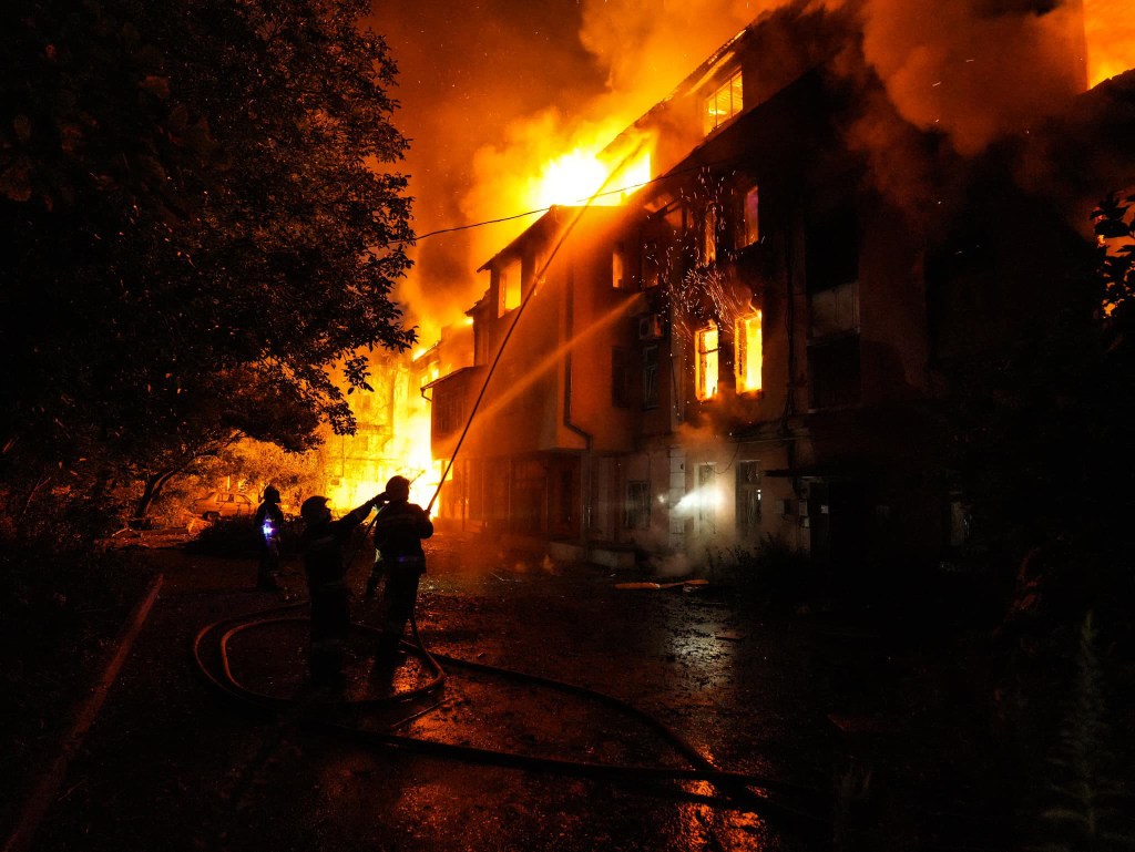 This handout photograph taken and released by the Ukrainian Emergency Service on July 20, 2023 shows rescuers extinguishing a fire at a destroyed residential building after a missile strike in the centre of Mykolaiv, amid the Russian invasion of Ukraine. (Photo by Handout / Ukraine Emergency Service / AFP) / RESTRICTED TO EDITORIAL USE - MANDATORY CREDIT "AFP PHOTO / " - NO MARKETING NO ADVERTISING CAMPAIGNS - DISTRIBUTED AS A SERVICE TO CLIENTS