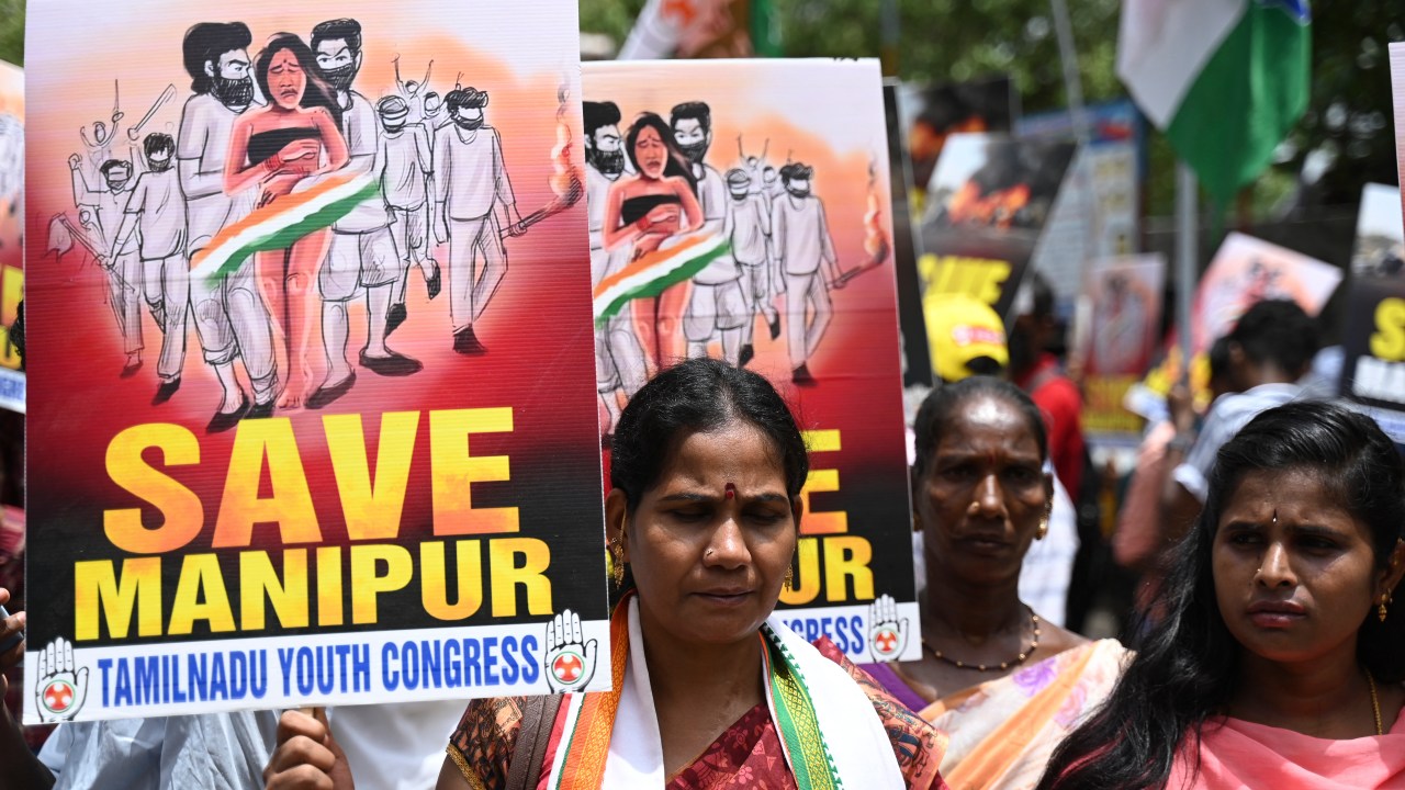 Activists of the Tamil Nadu Youth Congress take part in a demonstration against ongoing ethnic violence in India's north-eastern state of Manipur, in Chennai on July 21, 2023. India's Prime Minister Narendra Modi said on July 20 that the country has been "shamed" by a video showing a mob parading two women naked in a northeastern state where ethnic violence has claimed at least 120 lives. (Photo by R.Satish BABU / AFP)