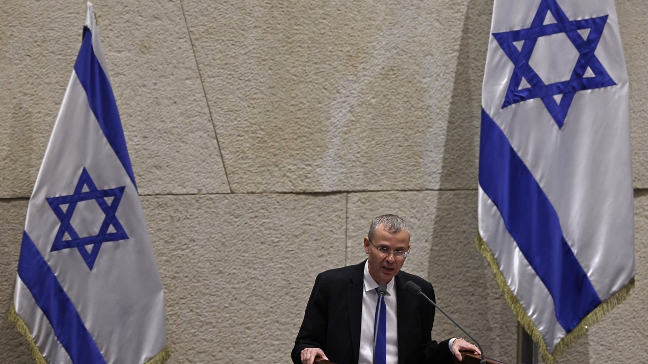 Israel's Minister of Justice Yariv Levin speaks during a parliament session in Jerusalem on July 24, 2023, amid a months-long wave of protests against the government's planned judicial overhaul. Israeli lawmakers on July 24 prepared for a final vote on a major component of the hard-right government's controversial judicial reforms even as US President Joe Biden called for postponing the "divisive" bill that has triggered mass protests. (Photo by RONALDO SCHEMIDT / AFP)