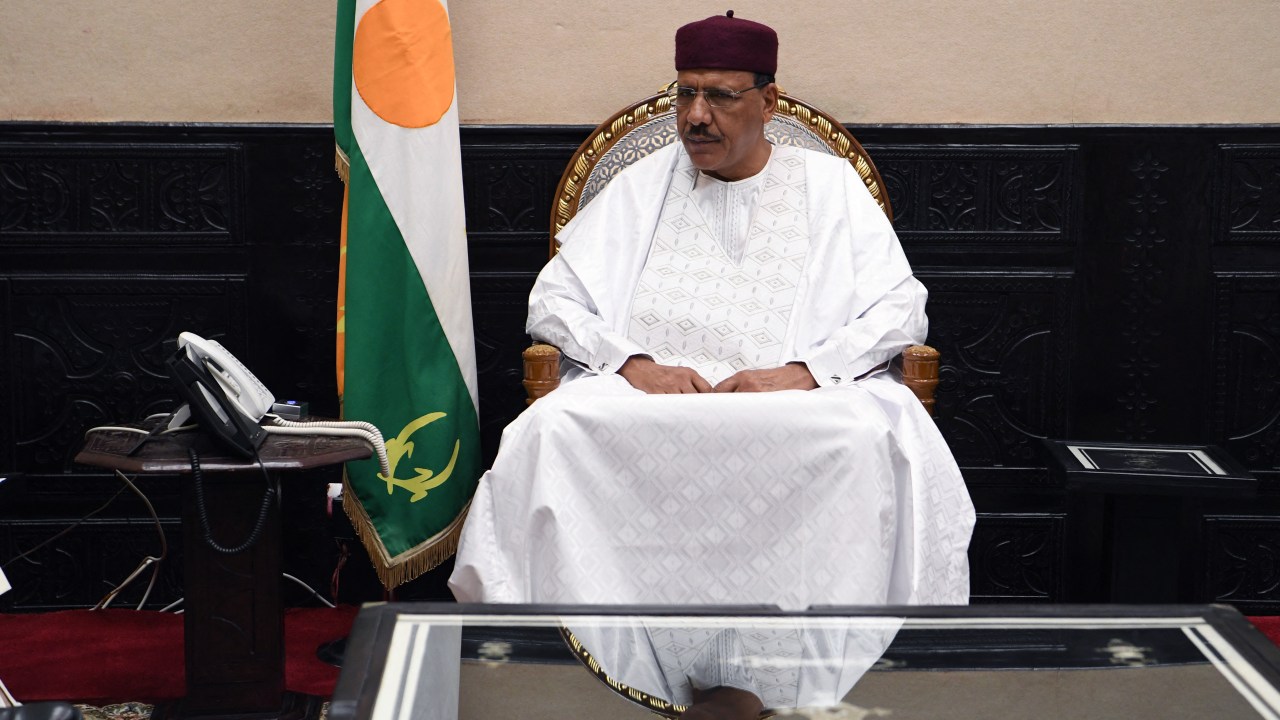 (FILES) Nigerien President Mohamed Bazoum meets with the French Foreign and Armies ministers during their official visit to Niamey on July 15, 2022. Access to the residence and offices of Niger President Mohamed Bazoum were blocked off on July 26, 2023 by members of the elite Presidential Guard, a source close to Bazoum said, although the reason was unclear. (Photo by BERTRAND GUAY / AFP)