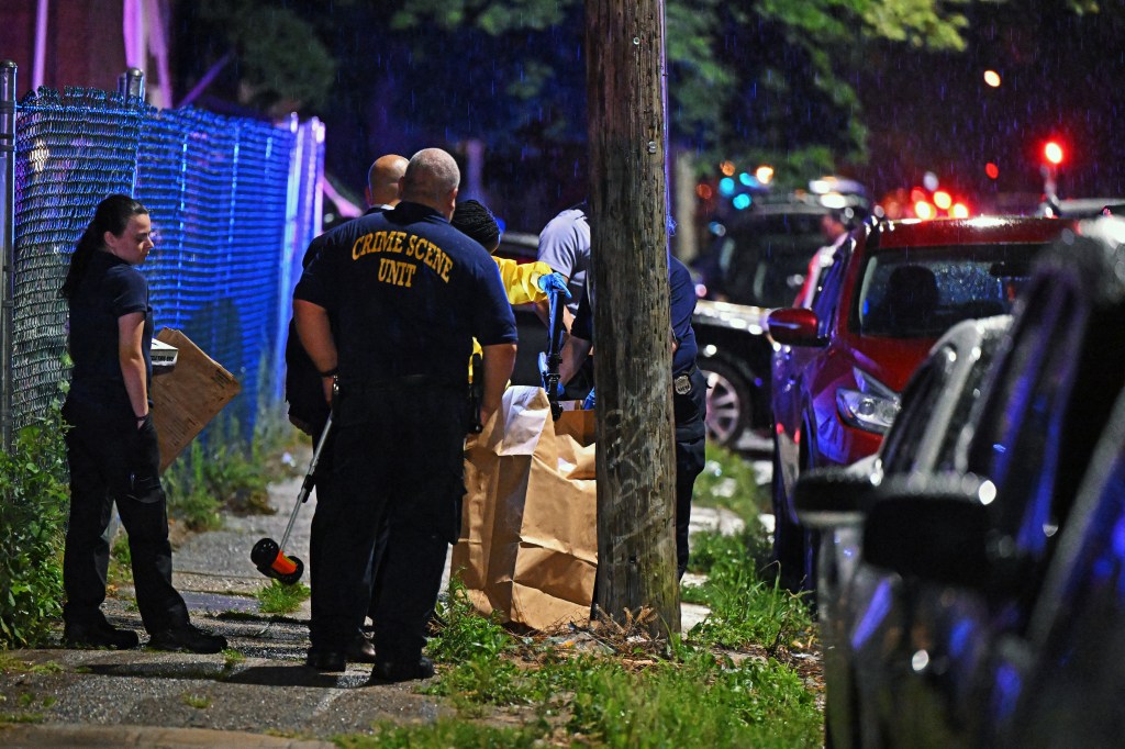 uPHILADELPHIA, PENNSYLVANIA - JULY 3: Police place a rifle in a bag on the scene of a shooting on July 3, 2023 in Philadelphia, Pennsylvania. Early reports say the suspect is in custody after shooting 8 people in the Kingsessing section of Philadelphia on July 3rd. Drew Hallowell/Getty Images/AFP (Photo by Drew Hallowell / GETTY IMAGES NORTH AMERICA / Getty Images via AFP)