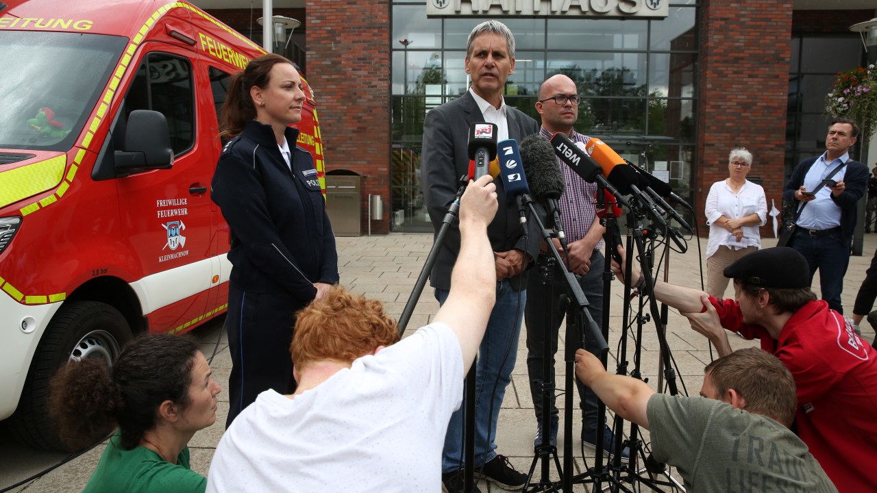 KLEINMACHNOW, GERMANY - JULY 20: (L to R) Brandenburg Police Spokeswoman Kerstin Schroeder, Kleinmachnow Mayor Michael Grubert and Kleinmachnow Volunteer Fire Department Chief Alexander Scholz attend a news conference about a possible escaped lion on July 20, 2023 outside the City Hall (Rathaus) in Kleinmachnow, in Brandenburg, near Berlin, Germany. Police and fire departments are tracking what they believe may be a female lion on the loose at the southern edge of the German capital, and have called on residents to stay indoors. (Photo by Adam Berry/Getty Images)