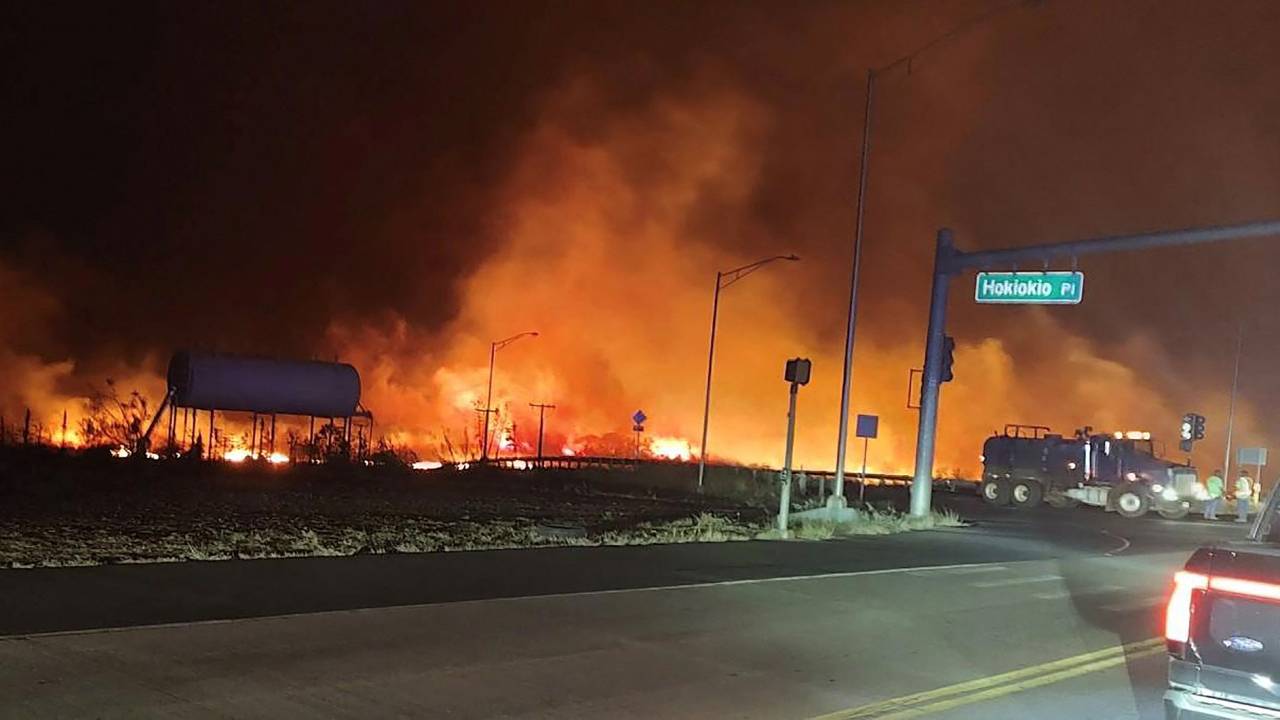 In this image obtained from the County of Maui in Hawaii, shows a wildfire in Lahaina, on August 9, 2023. Hawaii wildfires fanned by winds from Hurricane Dora forced evacuation late on August 8. The National Weather service reported that Dora, 500 miles (805kms) south of Hawaii was partly to blame for wind gusts above 60mph (97kph). (Photo by Zeke Kalua / County of Maui / AFP) / RESTRICTED TO EDITORIAL USE - MANDATORY CREDIT "AFP PHOTO / Zeke Kalua / County of Maui" - NO MARKETING NO ADVERTISING CAMPAIGNS - DISTRIBUTED AS A SERVICE TO CLIENTS