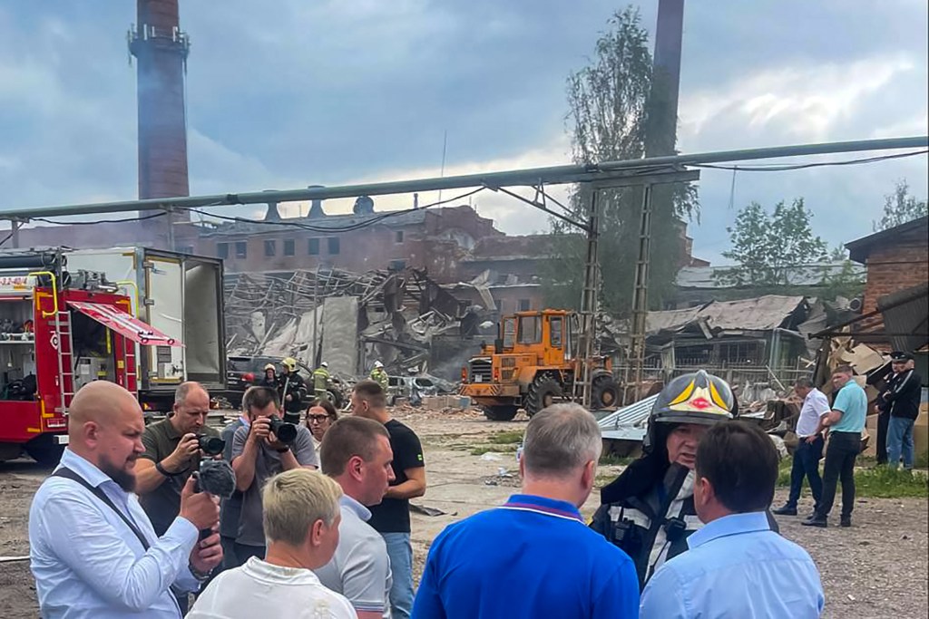 This handout picture posted on August 9, 2023 on the official Telegram account of Dmitry Akulov, the head of the Sergiyev Posad municipal district administration, shows officials visiting the site of an explosion that occured on the grounds of the Zagorsk Optical-Mechanical Plant in the city of Sergiyev Posad, some 35 miles (56 km) north-east of the capital Moscow. (Photo by Handout / Telegram / @DAkulovSP / AFP) / RESTRICTED TO EDITORIAL USE - MANDATORY CREDIT "AFP PHOTO / TELEGRAM / @DAkulovSP / handout" - NO MARKETING NO ADVERTISING CAMPAIGNS - DISTRIBUTED AS A SERVICE TO CLIENTS