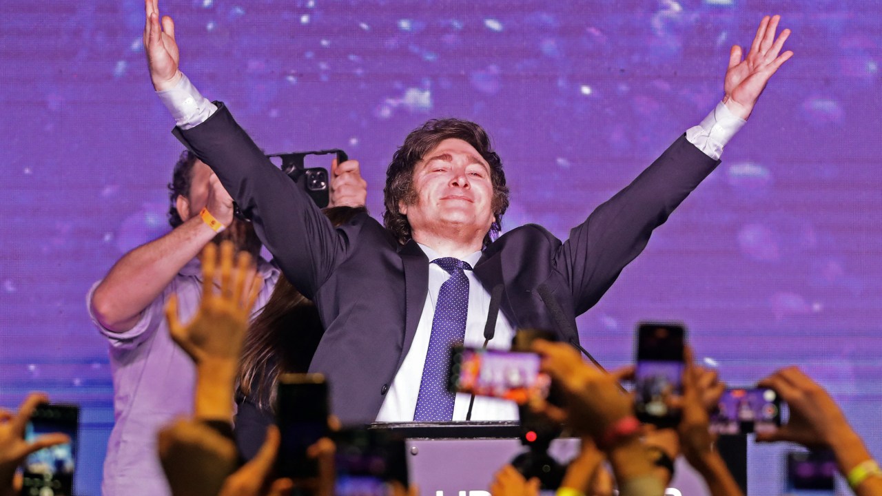 Argentine far-right libertarian economist and presidential candidate Javier Milei celebrates the results of the primary elections at his headquarters in Buenos Aires on August 13, 2023. The far-right libertarian economist Javier Milei gets 32.31% of the votes in the primaries for the Argentine presidential election, and becomes the protagonist of this election that will contest the former Security Minister Patricia Bullrich and the Economy Minister Sergio Massa. (Photo by ALEJANDRO PAGNI / AFP)
