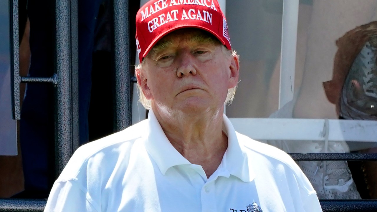 Former US President Donald Trump looks on during Round 3 at the LIV Golf-Bedminster 2023 at the Trump National in Bedminster, New Jersey on August 13, 2023. Donald Trump was indicted August 14, 2023 on charges of racketeering and a string of election crimes after a sprawling two-year probe into his efforts to overturn his 2020 defeat to Joe Biden in the US state of Georgia, according to a court filing. The case -- relying on laws typically used to bring down mobsters -- is the fourth targeting the 77-year-old Republican this year and could lead to a watershed moment, the first televised trial of a former president in US history. (Photo by TIMOTHY A. CLARY / AFP)