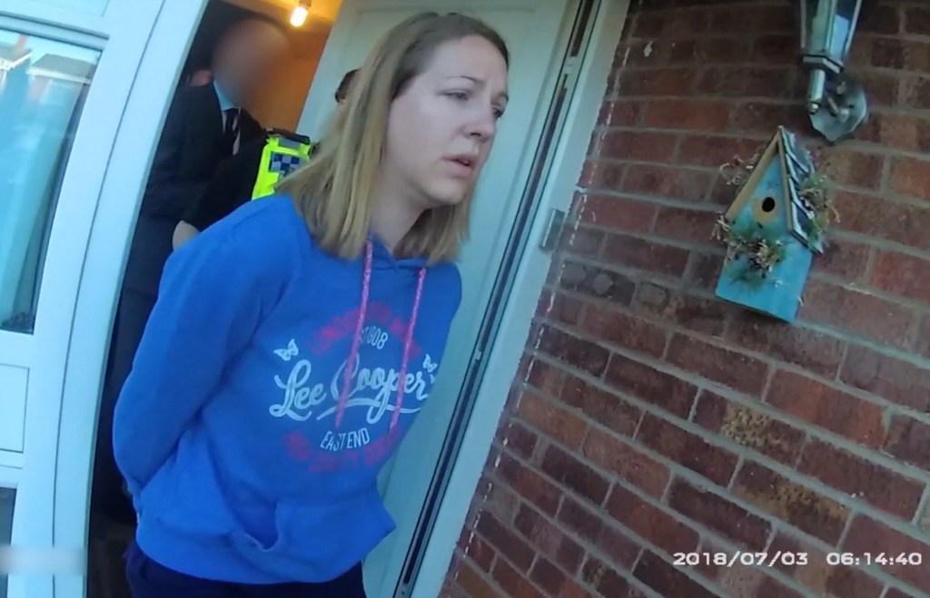 A handout image taken from police bodycam footage released by Cheshire Constabulary police force in Manchester on August 17, 2023, shows the nurse Lucy Letby being arrested at home in Chester on July 3, 2018. Lucy Letby was on August 18, 2023, found guilty of murdering seven newborn babies and trying to murder six others at the hospital neonatal unit where she worked, becoming the UK's most prolific killer of children. Letby, 33 -- on trial since October 2022 -- was accused of injecting her young victims, who were either sick or born prematurely, with air, overfeeding them milk and poisoning them with insulin. (Photo by Cheshire Constabulary / AFP) / RESTRICTED TO EDITORIAL USE - MANDATORY CREDIT " AFP PHOTO / Cheshire Constabulary/ Handout " - NO MARKETING NO ADVERTISING CAMPAIGNS - DISTRIBUTED AS A SERVICE TO CLIENTS