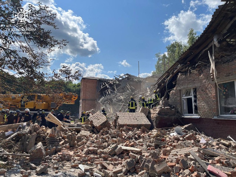 This handout photograph taken and released by the Ukrainian State Emergency Service on August 23, 2023 shows rescuers clearing debris of a destroyed school following a Russian strike, in the town of Romny, Sumy region, amid the Russian invasion of Ukraine. The death toll in a Russian strike on a school in the Ukrainian village of Romny, in the north-eastern region of Sumy, has risen to four, the authorities said on August 23, 2023. (Photo by Handout / Ukrainian State Emergency Service / AFP) / RESTRICTED TO EDITORIAL USE - MANDATORY CREDIT "AFP PHOTO / Ukrainian State Emergency Service" - NO MARKETING NO ADVERTISING CAMPAIGNS - DISTRIBUTED AS A SERVICE TO CLIENTS