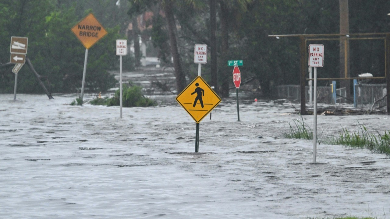 A flooded street is seen near the Steinhatchee marina, Florida on August 30, 2023, after Hurricane Idalia made landfall. Idalia barreled into the northwest Florida coast as a powerful Category 3 hurricane on Wednesday morning, the US National Hurricane Center said. "Extremely dangerous Category 3 Hurricane #Idalia makes landfall in the Florida Big Bend," it posted on X, formerly known as Twitter, adding that Idalia was causing "catastrophic storm surge and damaging winds." (Photo by CHANDAN KHANNA / AFP)