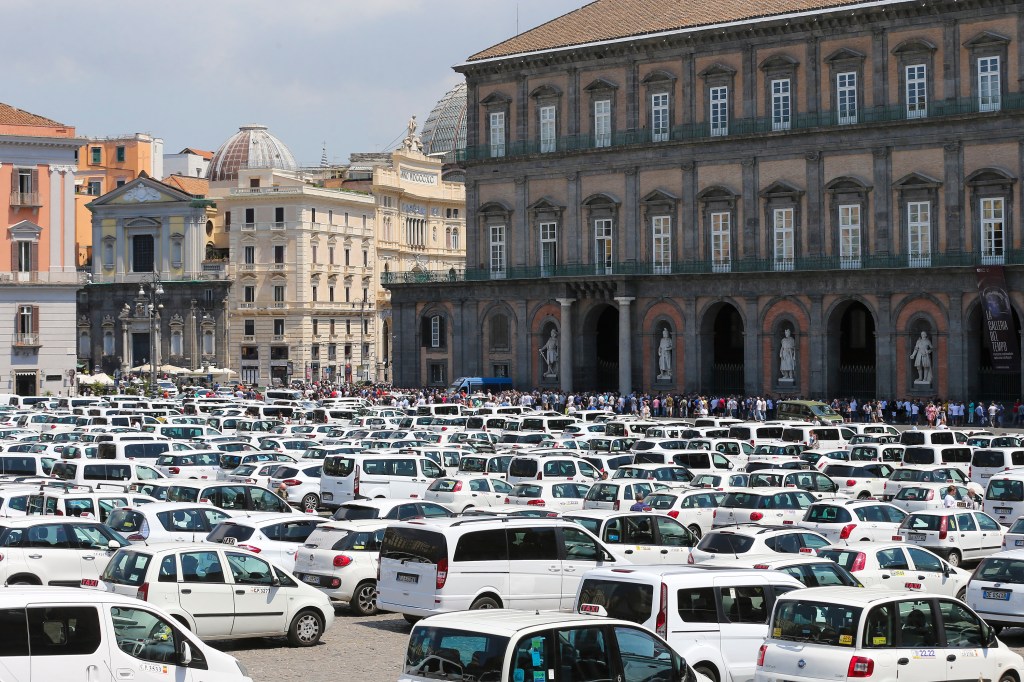 NAPLES, ITALY - 2022/07/12: Over 500 taxis in Plebiscito square in Naples, due to the protest of taxi drivers, against the Italian government, for the deregulation of the sector, and against Uber, the private service for car transport. (Photo by Marco Cantile/LightRocket via Getty Images)