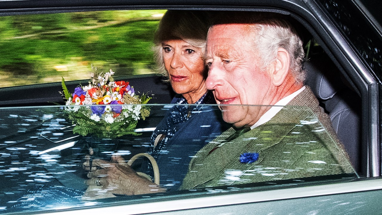 Britain's King Charles III (R) and Britain's Queen Camilla (L) leave after attending church in the village of Crathie, near Balmoral in central Scotland on September 8, 2023, on the first anniversary of the passing of the King's mother, Queen Elizabeth II. Britain on Friday, September 8, mark the first anniversary of Queen Elizabeth II's death but commemorations will be low-key with no official public events planned. (Photo by ANDY BUCHANAN / AFP)