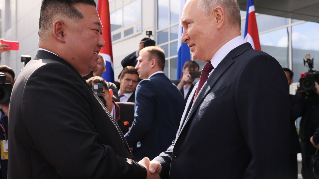 In this pool photo distributed by Sputnik agency, Russia's President Vladimir Putin (R) shakes hands with North Korea's leader Kim Jong Un (L) during their meeting at the Vostochny Cosmodrome in Amur region on September 13, 2023. Russian President Vladimir Putin and North Korean leader Kim Jong Un both arrived at the Vostochny Cosmodrome in Russia's Far East, Russian news agencies reported on September 13, ahead of planned talks that could lead to a weapons deal. (Photo by Mikhail METZEL / POOL / AFP)