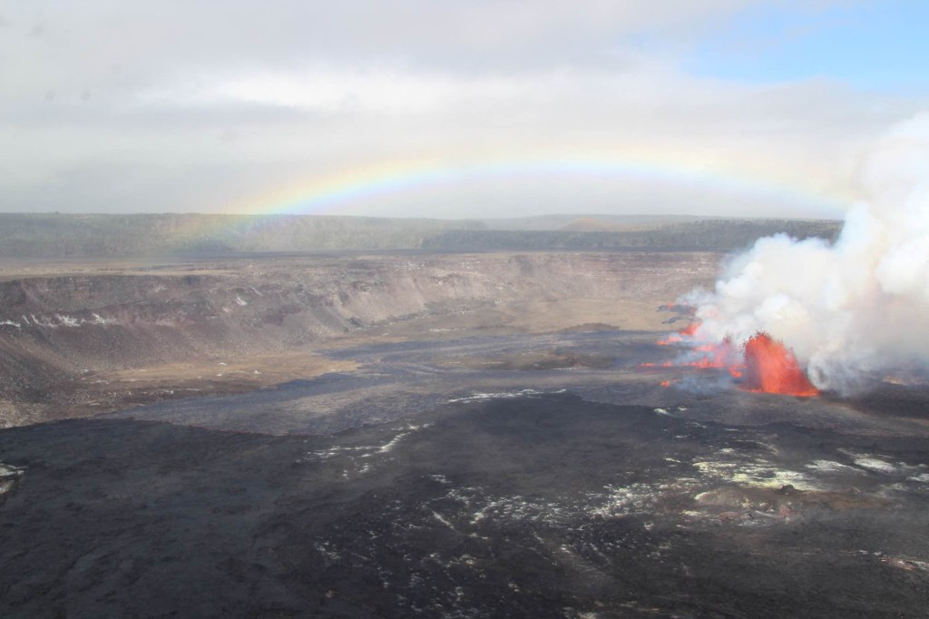 This handout photo provided by USGS shows a rainbow over the new eruption at the summit of Kilauea Volcano at Hawaii Volcanoes National Park on September 10, 2023. Hawaii's Kilauea volcano, one of the world's most active, erupted again on September 10, 2023, spewing fountains of lava more than 80 feet (24 meters) high. Kilauea began erupting at around 3:15 pm local time (0115 GMT September 11, 2023), the US Geological Survey's Hawaiian Volcano Observatory said. It is the third time the volcano has erupted this year, after bursting to life in January and June. (Photo by USGS Volcanoes / AFP) / RESTRICTED TO EDITORIAL USE - MANDATORY CREDIT "AFP PHOTO / USGS Volcanoes" - NO MARKETING NO ADVERTISING CAMPAIGNS - DISTRIBUTED AS A SERVICE TO CLIENTS