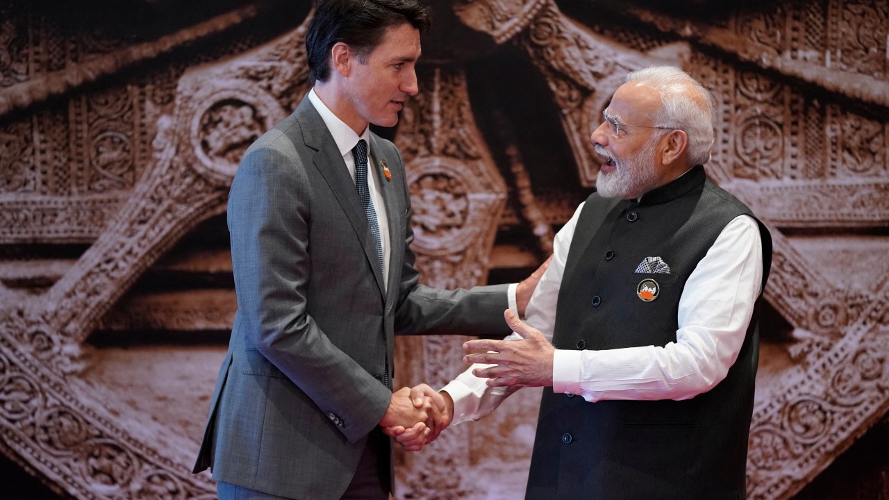 (FILES) India's Prime Minister Narendra Modi (R) shakes hand with Canada's Prime Minister Justin Trudeau ahead of the G20 Leaders' Summit in New Delhi on September 9, 2023. Canada on September 18 accused India's government of involvement in the killing of a Canadian Sikh leader near Vancouver last June, prompting tit-for-tat diplomatic expulsions after New Delhi rejected the charge as "absurd." (Photo by Evan Vucci / POOL / AFP)
