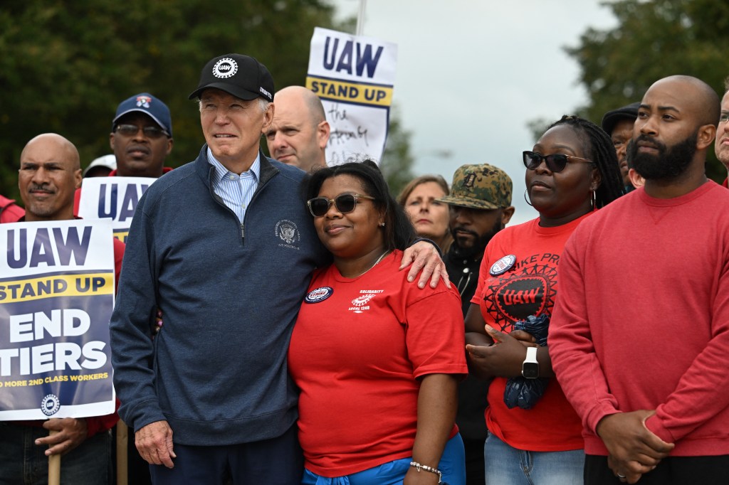 US President Joe Biden joins a picket line with members of the United Auto Workers (UAW) union at a General Motors Service Parts Operations plant in Belleville, Michigan, on September 26, 2023. Some 5,600 members of the UAW walked out of 38 US parts and distribution centers at General Motors and Stellantis at noon September 22, 2023, adding to last week's dramatic worker walkout. According to the White House, Biden is the first sitting president to join a picket line. (Photo by Jim WATSON / AFP)