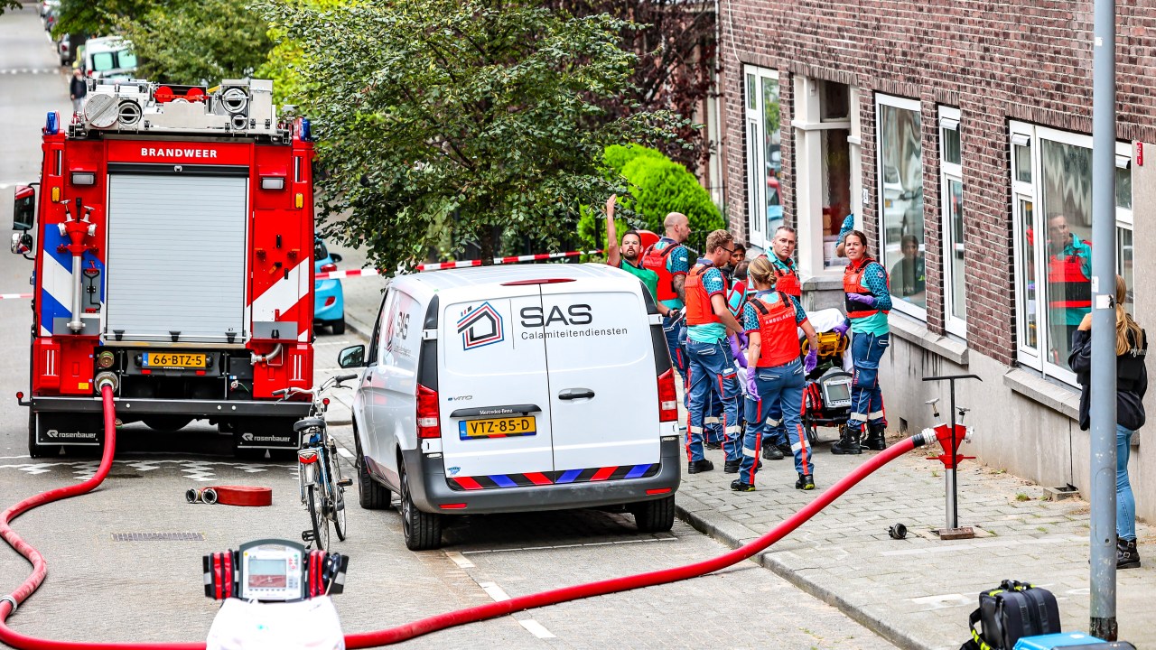Members of the fire brigade work at a fire in a building on Heiman Dullaertplein, after shootings in Rotterdam, on September 28, 2023. Twin shootings in Rotterdam on Thursday have resulted in an unknown number of fatalities, police said. A gunman dressed in combat gear opened fire in a flat in the Dutch city then burst into the Erasmus University Medical Center (Erasmus MC). Fires broke out in both places but were later extinguished. (Photo by Marco van der Caaij / ANP / AFP) / Netherlands OUT