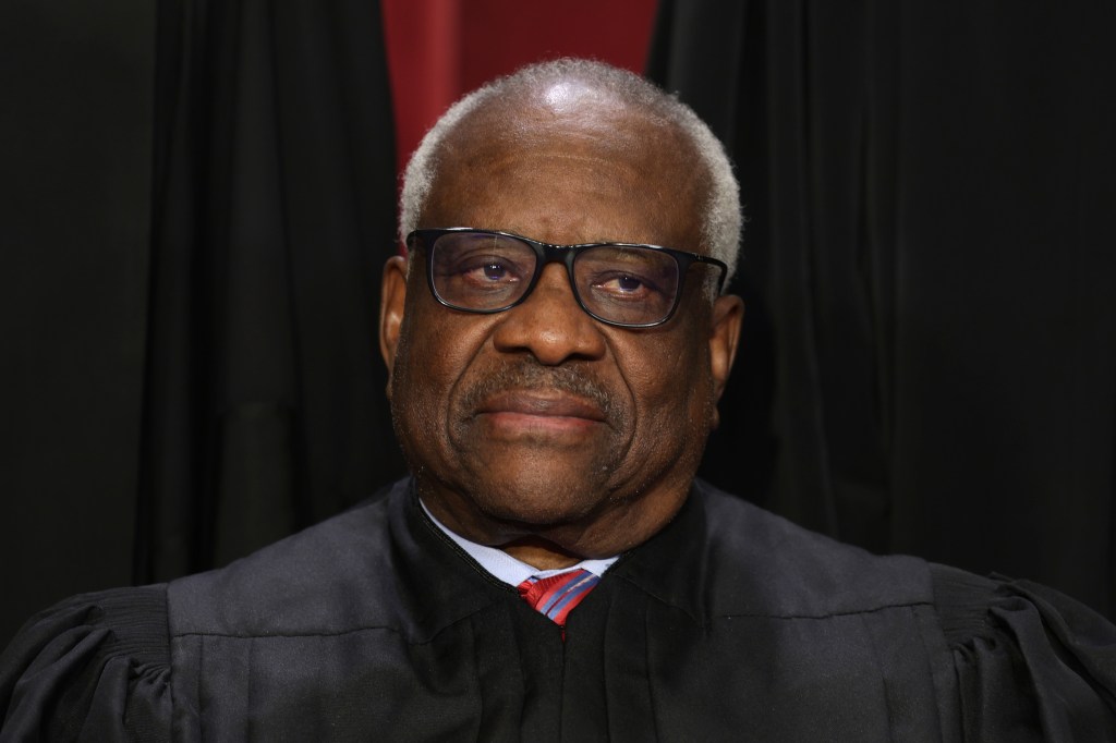 WASHINGTON, DC - OCTOBER 07: United States Supreme Court Associate Justice Clarence Thomas poses for an official portrait at the East Conference Room of the Supreme Court building on October 7, 2022 in Washington, DC. The Supreme Court has begun a new term after Associate Justice Ketanji Brown Jackson was officially added to the bench in September. (Photo by Alex Wong/Getty Images)