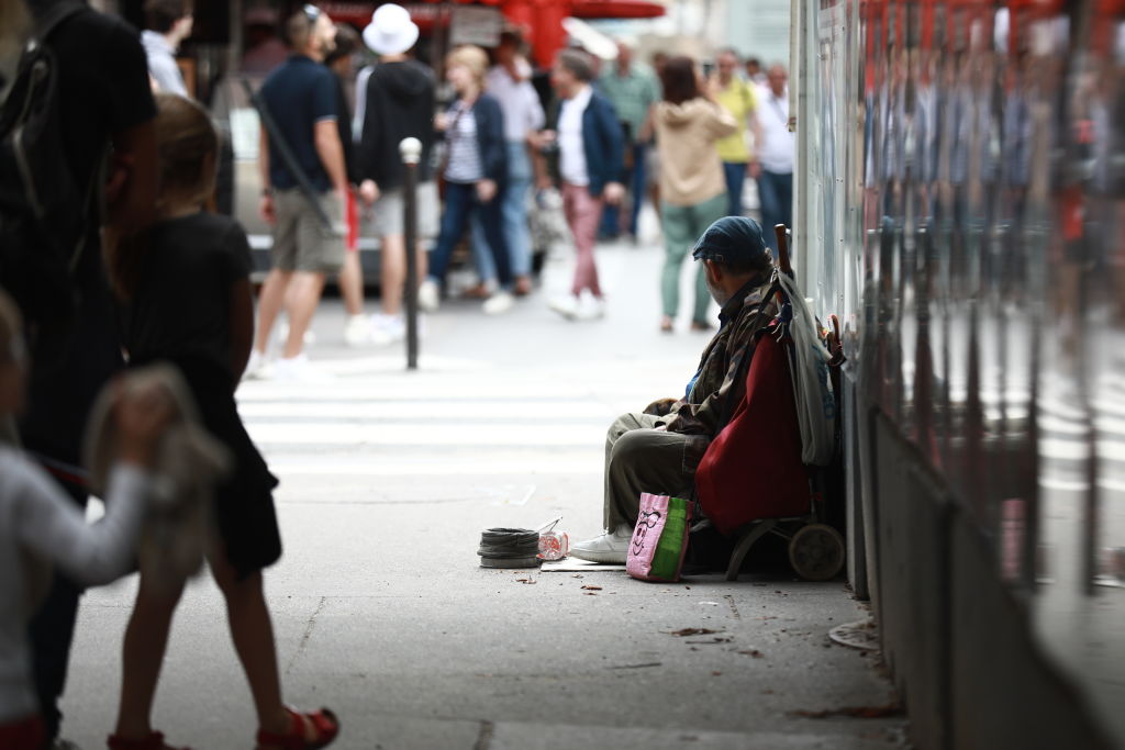 PARIS, FRANCE - JULY 29: A homeless man is seen on the street ahead of 2024 Olympic Games in Paris, France on August 29, 2023. One of the biggest problems ahead of the 2024 Olympic Games in Paris is the homeless people living on the streets of the city. (Photo by Mohamad Salaheldin Abdelg Alsayed/Anadolu Agency via Getty Images)